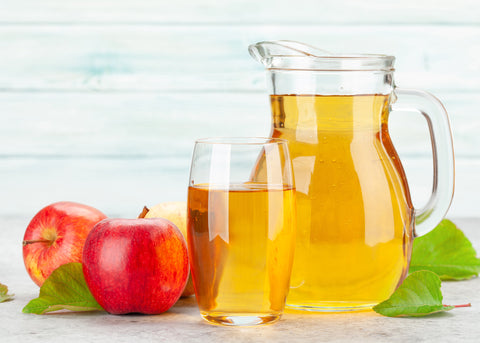 Pitcher and glass of fresh apple juice