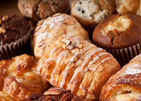 An assortment of baked goods, including croissants and muffins
